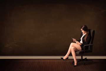 Poster - Businesswoman holding high tech tablet on background with copysp