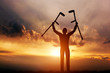 © Photocreo Bednarek - A disabled man raising his crutches at sunset. Medical miracle.