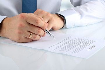 Businessman is signing a contract, business contract details