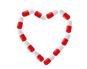 Wall Mural - Pills as heart symbol isolated on white