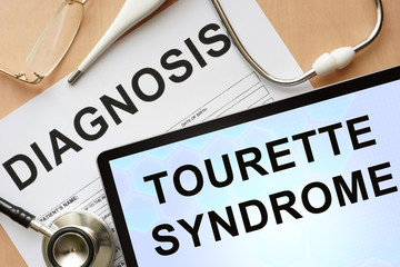 Wall Mural - Tablet with diagnosis Tourette syndrome  and stethoscope.