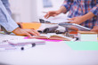 © lenetsnikolai - Young business people working at office on new project