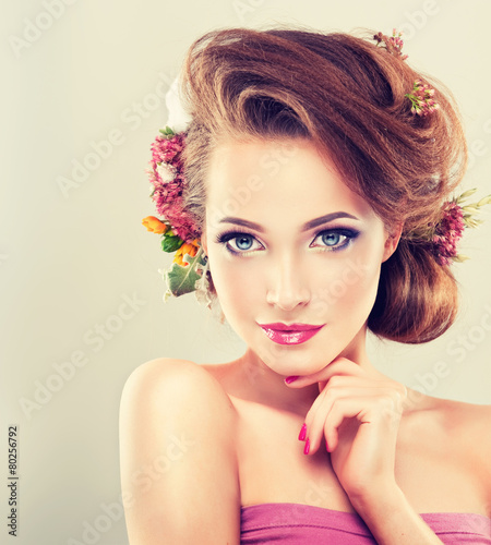 Naklejka na meble Spring girl with flowers in her hair and fashion makeup
