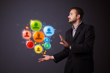 Social network icons in the hand of a businessman