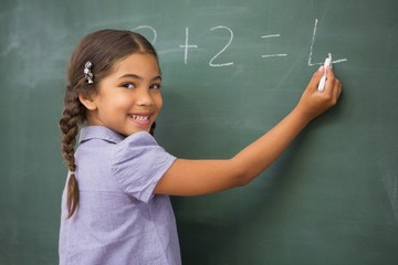 Poster - Pupil writing numbers on a blackboard