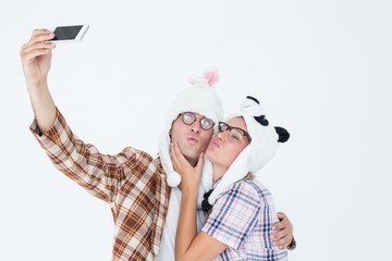 Poster - Geeky hipster couple taking selfie with smart phone