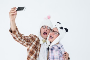 Poster - Geeky hipster couple taking selfie with smart phone