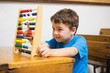 © WavebreakMediaMicro - Student doing maths on abacus