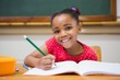 © WavebreakMediaMicro - Cute pupils writing at desk in classroom