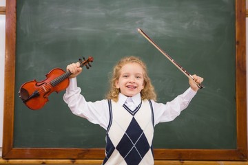 cute pupil holding violin and violin string