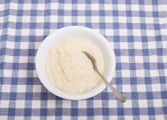 Wall Mural - Bowl of White Grits on Blue Check Tablecloth