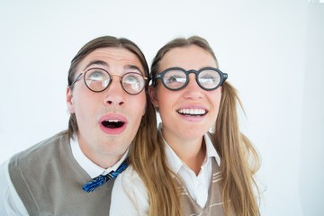 Poster - Geeky hipster couple raising eyes