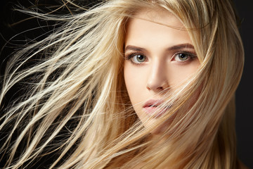 portrait of blonde girl with fluttering hair