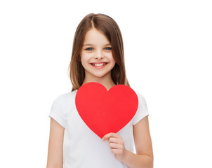 Canvas Print - smiling little girl with red heart