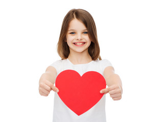 Poster - smiling little girl giving red heart