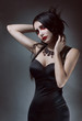 © FlexDreams - Pretty brunnete woman in black dress
