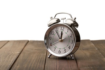 Clock. Vintage background with retro alarm clock on table