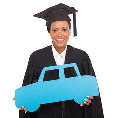 Wall Mural - young african american graduate holding a car symbol