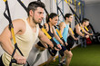 © FotoAndalucia - People training at elastic rope in gym