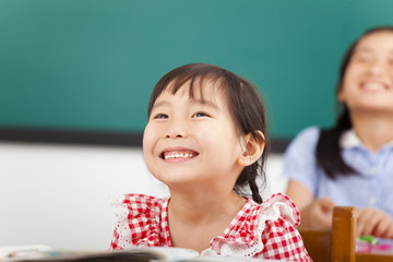 Canvas Print - happy little girls in the classroom