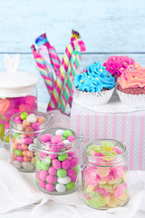 Sticker - Multicolor candies in glass jars and cupcakes