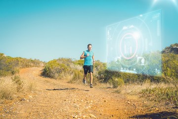 Poster - Composite image of athletic man jogging on country trail