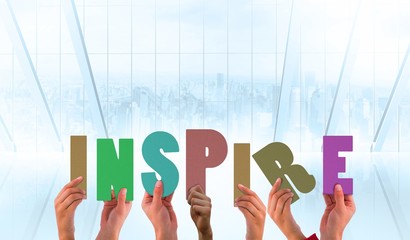 Poster - Composite image of hands holding up inspire