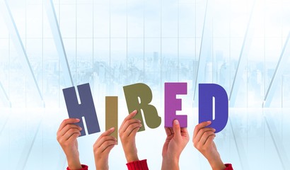 Poster - Composite image of hands holding up hired