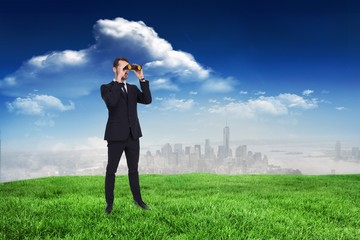 Poster - Elegant businessman standing and using binoculars