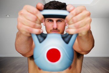 Poster - Composite image of bodybuilder holding kettlebell