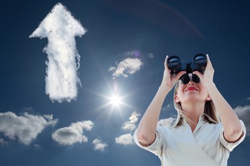 Poster - Composite image of businesswoman looking through binoculars