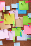 Fototapeta  - Image of colorful sticky notes on cork bulletin board