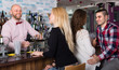 © JackF - Group of young adults in bar