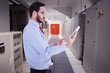 © WavebreakmediaMicro - Composite image of businessman scrolling on his digital tablet