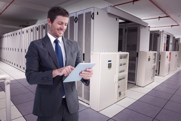 Aufkleber - Composite image of businessman using his tablet pc