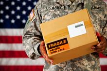 Soldier: Holding A Package With Blank Label
