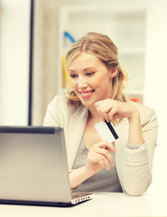 Poster - happy woman with laptop computer and credit card