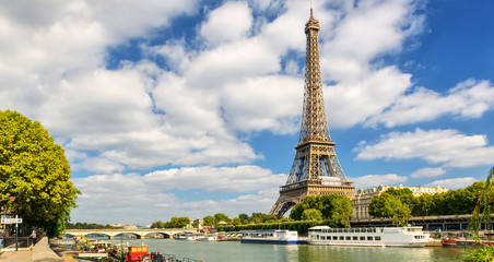 Wall Mural - Eiffel tower and blue sky, Paris, France. Panorama of Seine river in summer.