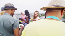 Happy Group Of Friends Enjoying Bbq And Drinks Outdoors At Rooftop Apartment