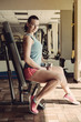 © FoodAndPhoto - Fitness girl in training with dumbbells.