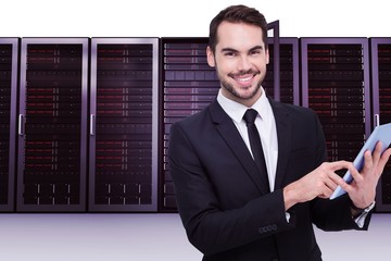 Aufkleber - Businessman using his tablet while looking at the camera