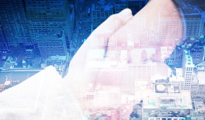 Poster - Composite image of close up on new partners shaking hands