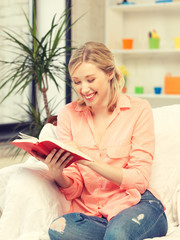 Wall Mural - happy and smiling woman with book