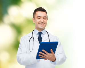 Canvas Print - smiling male doctor in white coat with tablet pc