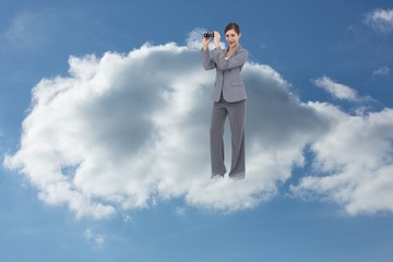 Poster - Composite image of businesswoman posing with binoculars