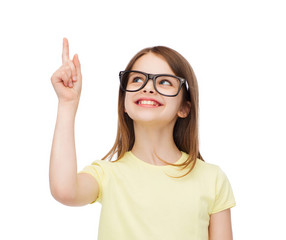 Canvas Print - smiling cute little girl in black eyeglasses