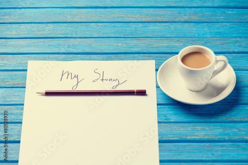 Fotografie, Obraz pencil and paper with My Story words near cup of coffee