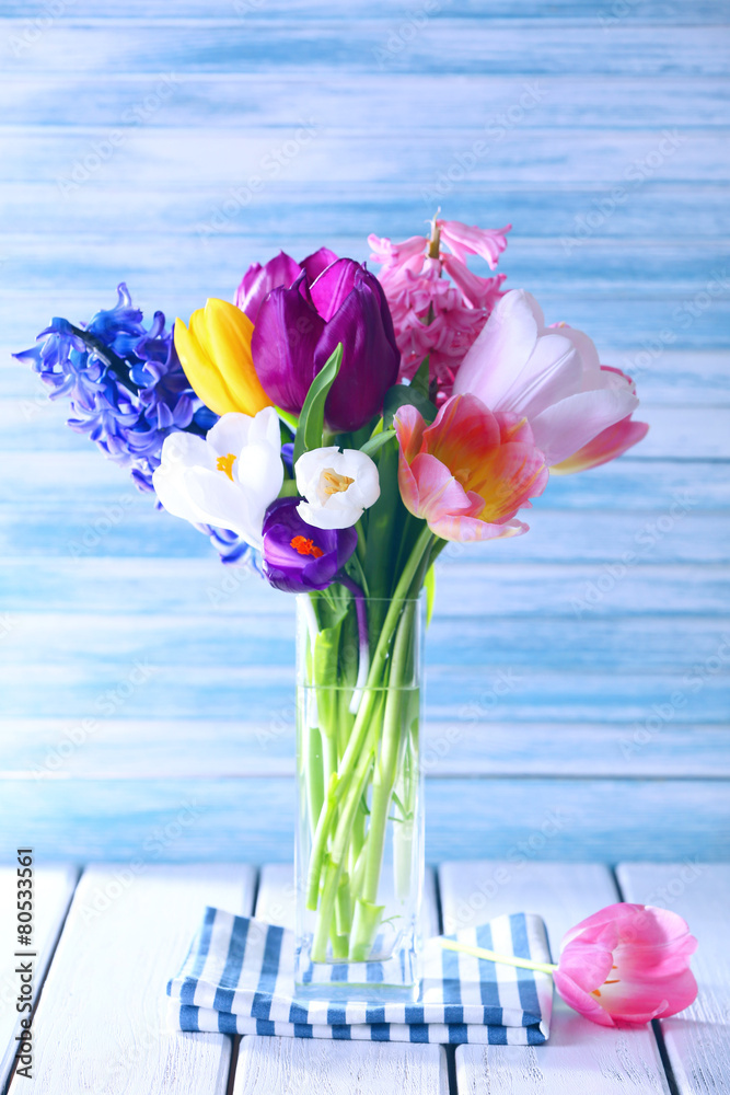 Beautiful spring flowers on color background