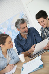 Canvas Print - Students with trainer working on project