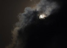 View On Partial Solar Eclipse Behind Clouds